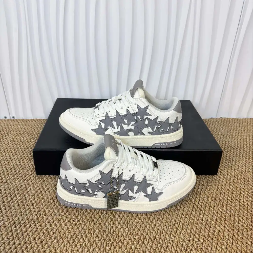 Amiri Skel Top Low grey and white star patch low-top sneakers